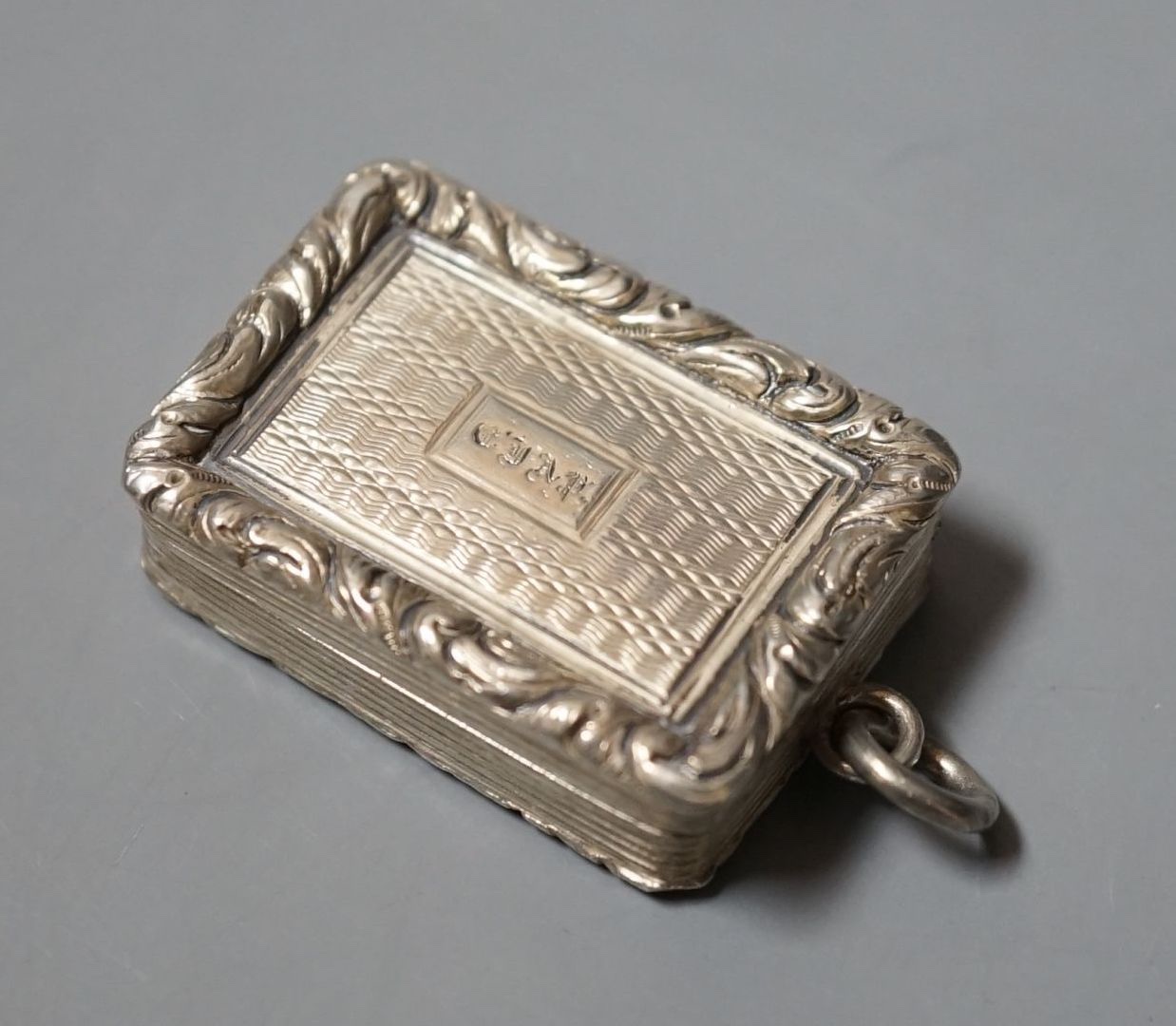 A George IV engine turned silver rectangular vinaigrette, Thomas Shaw, Birmingham, 1824, 33mm.